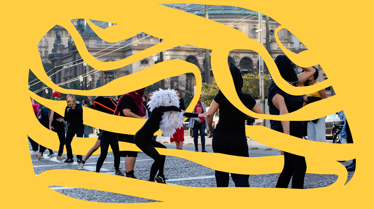 Foto de artistas da dança durante uma performance na rua